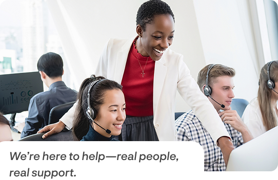 Customer support team smiling and assisting customers in a busy call center environment, alongside blue icons for phone and email contact options indicating ways to reach Movegistics support by phone at 1-855-MOVECRM or by email at info@netensity.com.